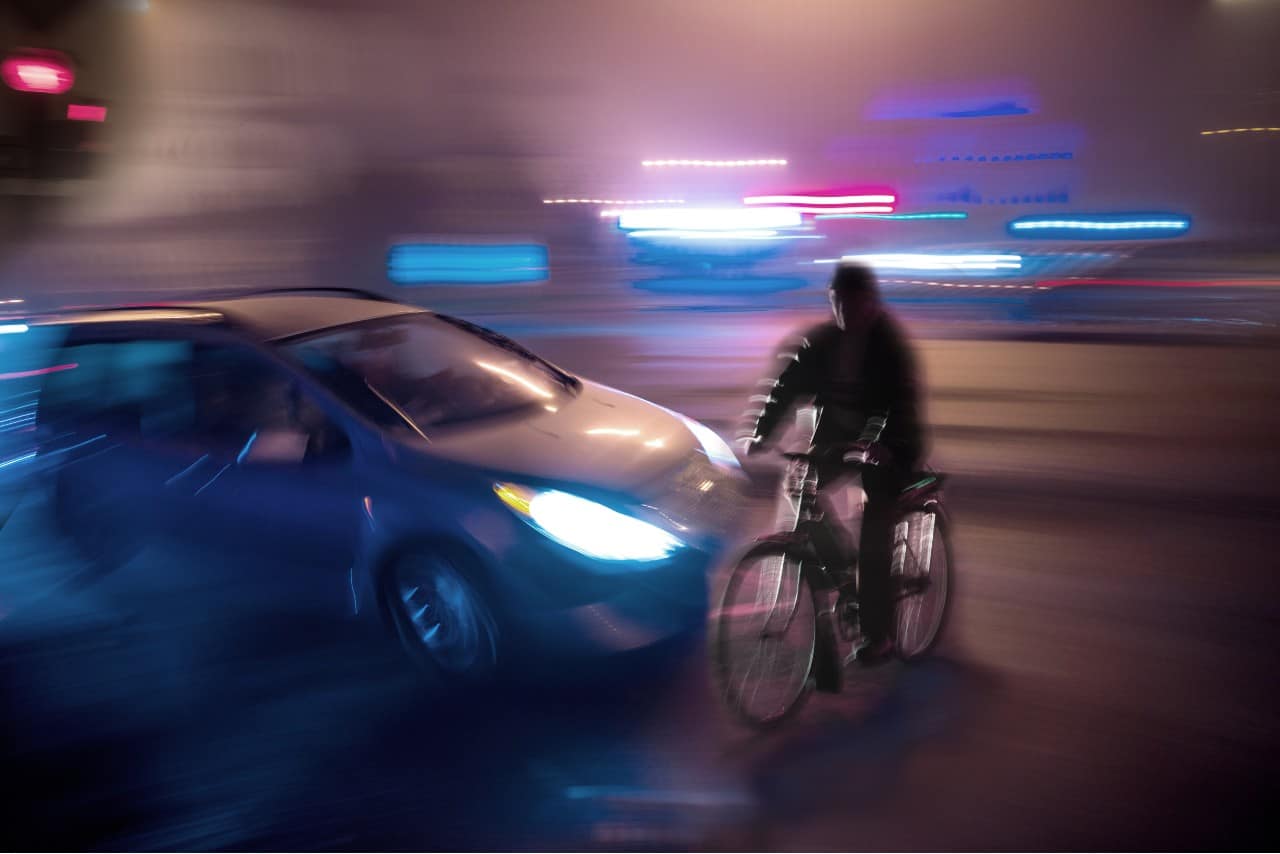 car about to hit bicycle rider in an accident