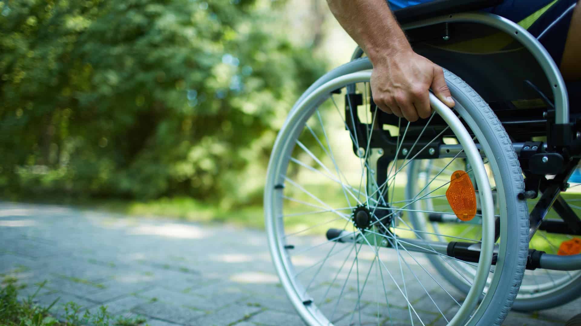 wheelchair on a nursing home sidewalk