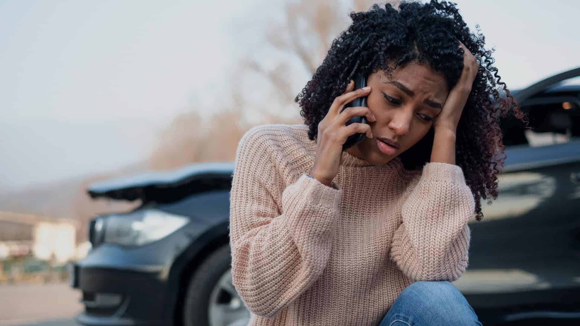 woman on the phone after a car accident